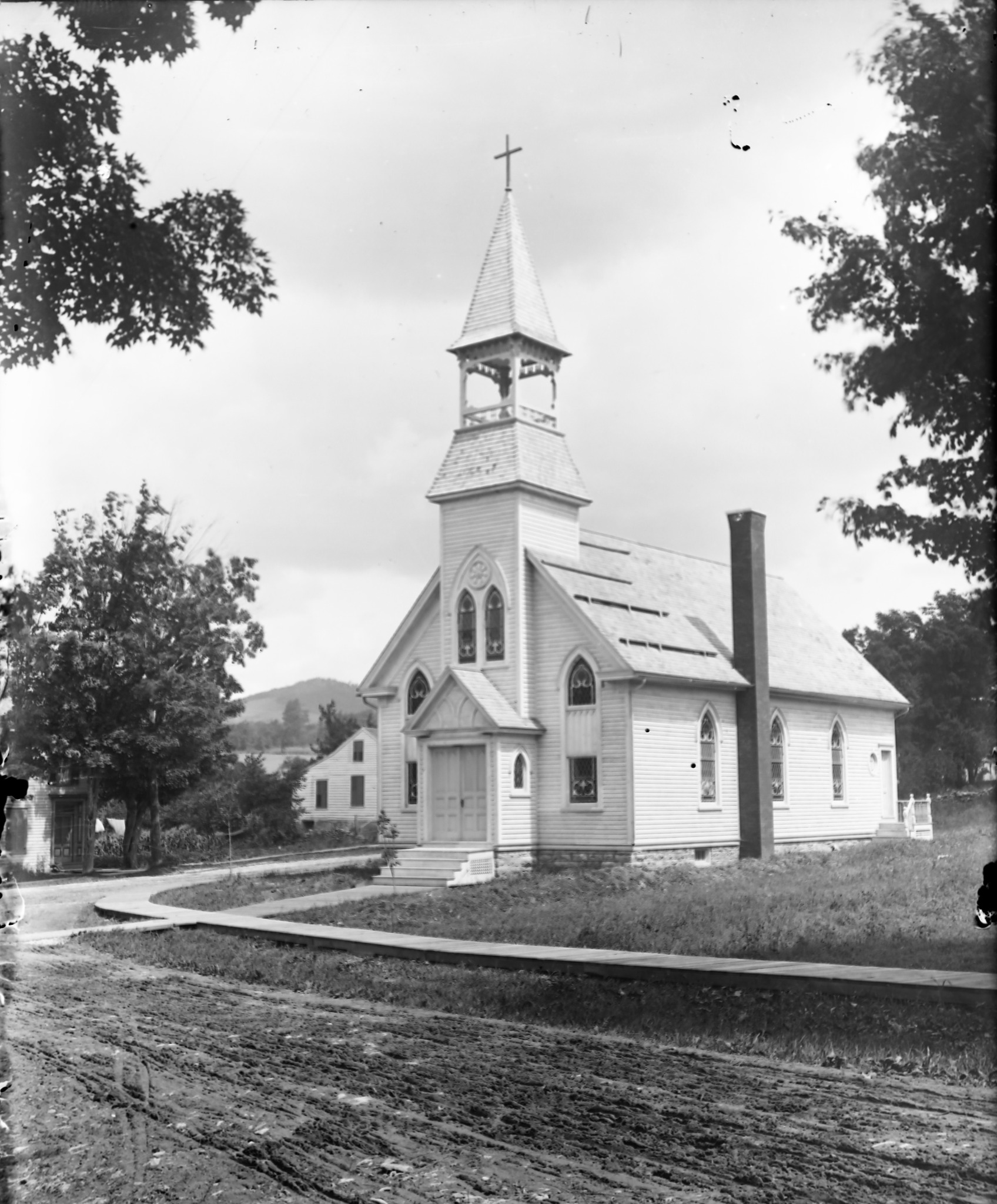 Church bell and historic church exterior