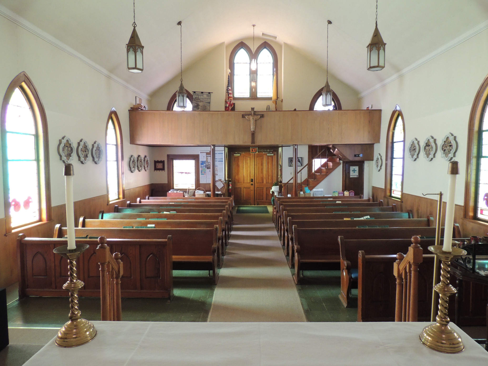 Front interior view of pews and church entrance